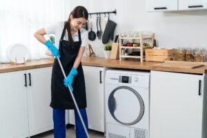 Asian active cleaning service woman worker cleaning mopping on floor for housekeeping